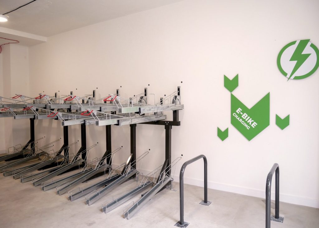 Indoor bike parking with two tier racks for e-bikes